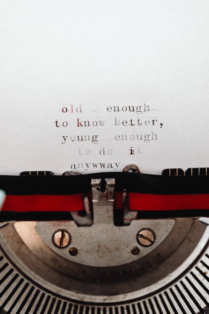 gallery-6 Close-up of a typewriter with an inspirational quote emphasizing youthful spirit and wisdom.
